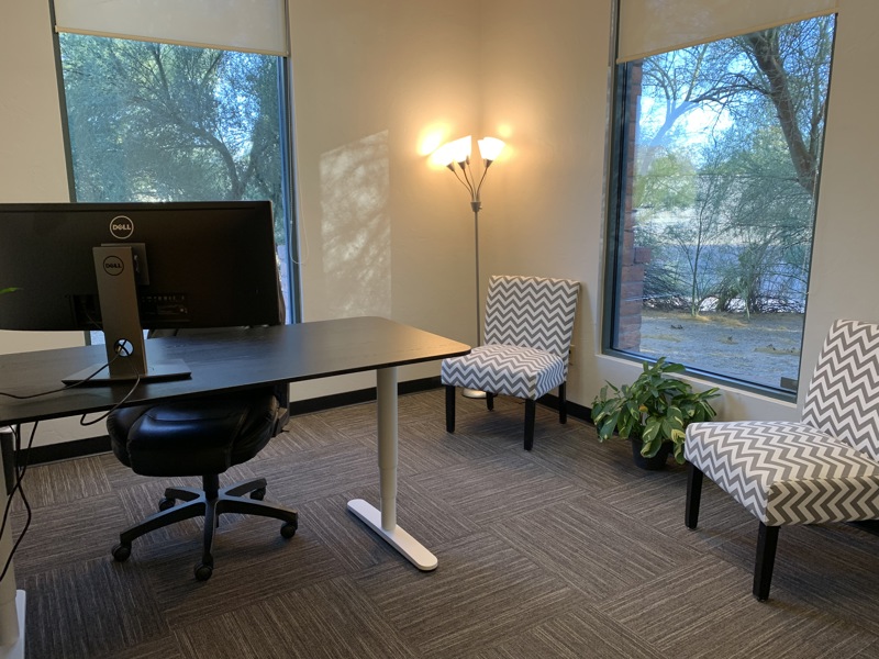 A photograph of a suite labeled 'Suite 110'.