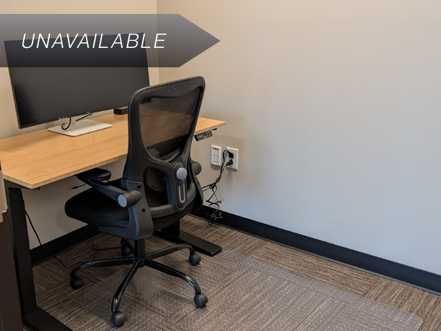 Private micro office Suite 134 featuring a bamboo sit-stand desk, ergonomic mesh chair, and a 34-inch curved monitor.