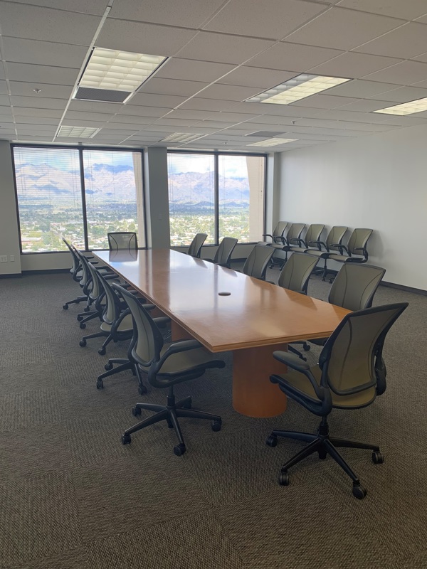 The Catalina Conference Center meeting room featuring a long wooden table and scenic mountain views.