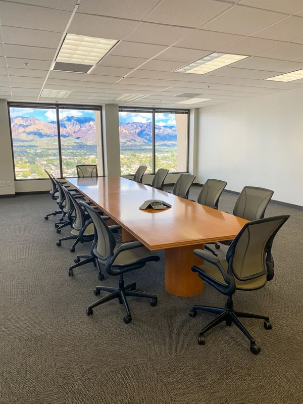 Large conference room at The Catalina Conference Center with a long wooden table and panoramic mountain views.
