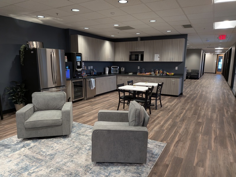 An interior view of the Spoke Tower Lounge featuring modern furniture and ambient lighting.